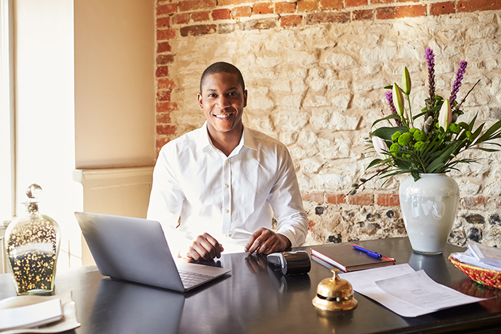 Gain access to a wider client-base by becoming friendly with local hotel concierges. (Photo: Monkey Business Images/Shutterstock)